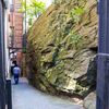 This Gigantic Rock Jammed Between Two Buildings Is A Huge Part Of NYC History
